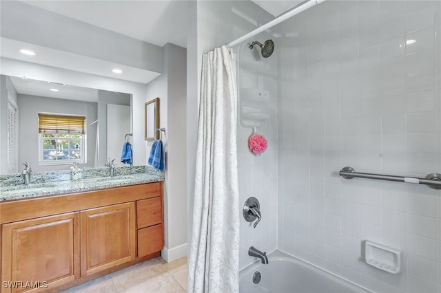 bathroom featuring double vanity, tile patterned floors, a sink, and shower / tub combo with curtain