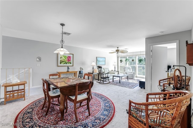 dining area with ceiling fan, carpet flooring, visible vents, and baseboards