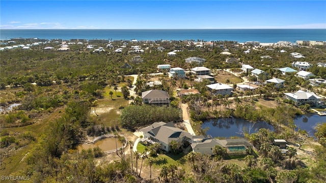 aerial view featuring a residential view and a water view