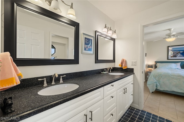 full bathroom with a sink, tile patterned flooring, double vanity, and connected bathroom