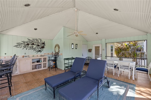 view of patio with outdoor dining space and a ceiling fan