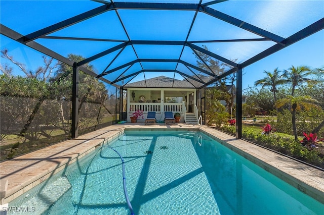 outdoor pool with a patio and a lanai