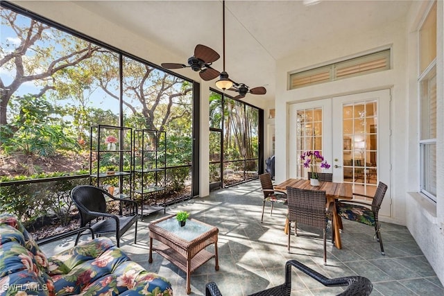 sunroom featuring french doors and ceiling fan