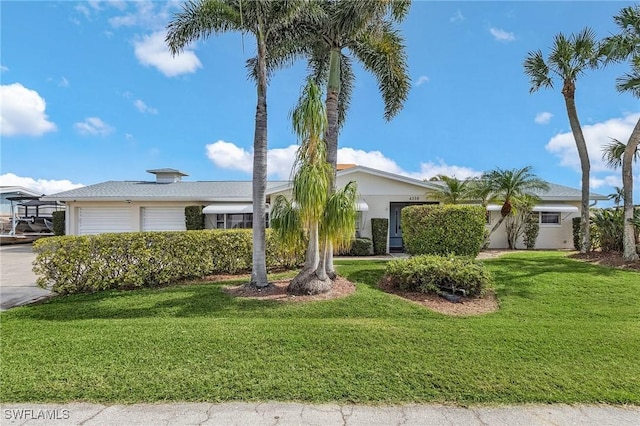 ranch-style home featuring a front lawn