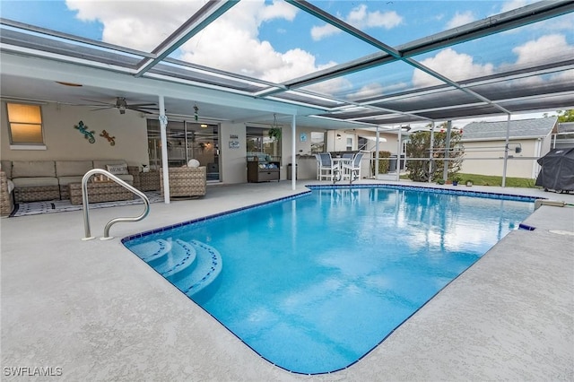 view of swimming pool featuring a patio, an outdoor hangout area, ceiling fan, and glass enclosure