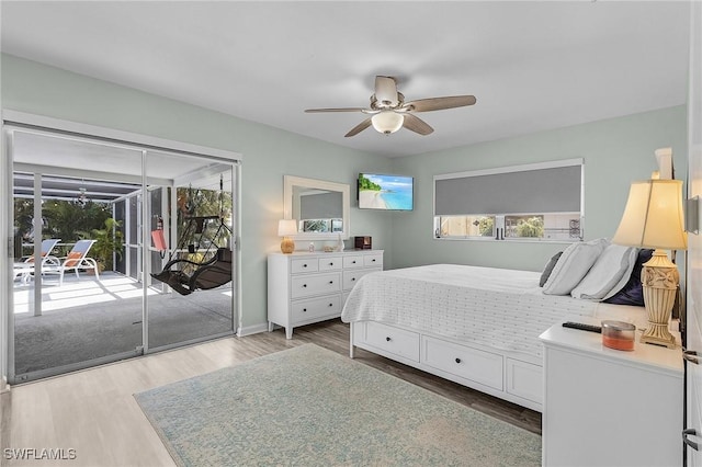 bedroom with ceiling fan, light hardwood / wood-style flooring, and access to outside