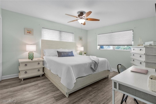 bedroom featuring ceiling fan and wood-type flooring