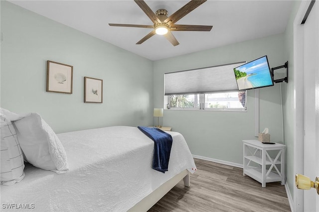 bedroom featuring ceiling fan and light wood-type flooring