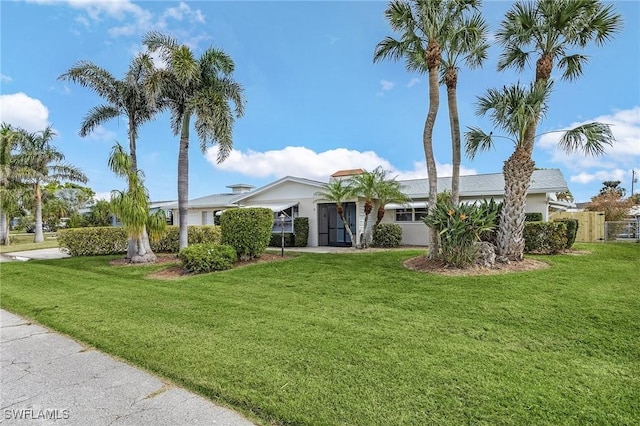 single story home featuring a front yard