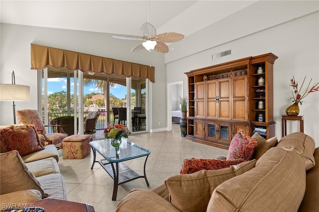 living room featuring light tile patterned flooring, high vaulted ceiling, and ceiling fan