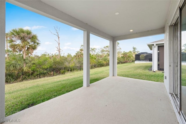 view of patio with glass enclosure