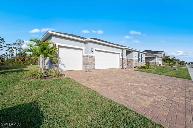 view of front facade with a front yard and a garage