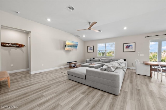 living room with light wood-type flooring, lofted ceiling, and ceiling fan