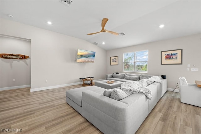 living room featuring light wood-type flooring, lofted ceiling, and ceiling fan