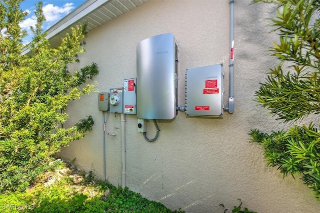 exterior space featuring electric meter and stucco siding