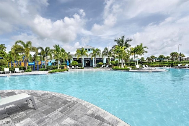 community pool with a patio area