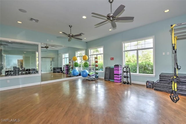 exercise area featuring visible vents, baseboards, wood finished floors, and recessed lighting