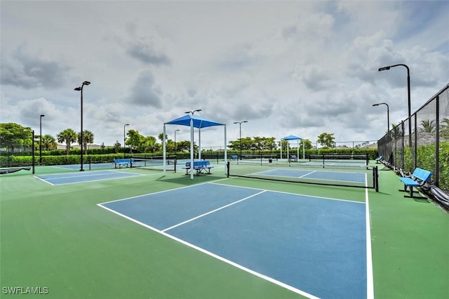 view of sport court with fence