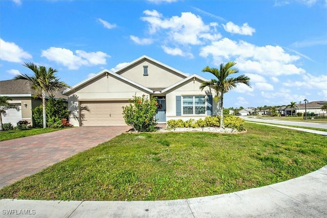 single story home featuring a front yard, decorative driveway, an attached garage, and stucco siding