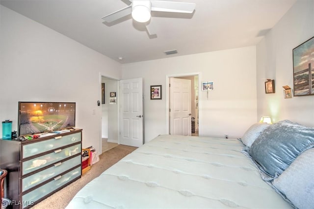 bedroom featuring light carpet, visible vents, and a ceiling fan