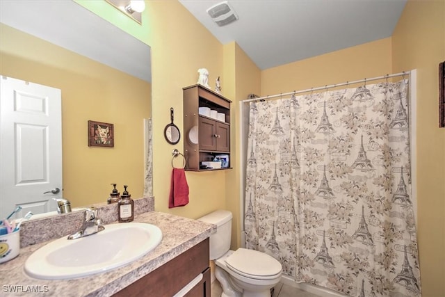 full bath with visible vents, curtained shower, vanity, and toilet