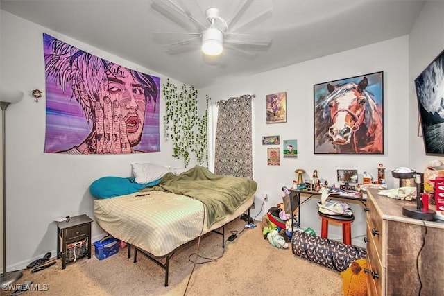 carpeted bedroom featuring ceiling fan and baseboards