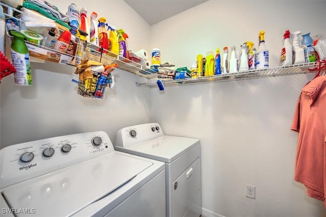 clothes washing area with laundry area and washer and dryer