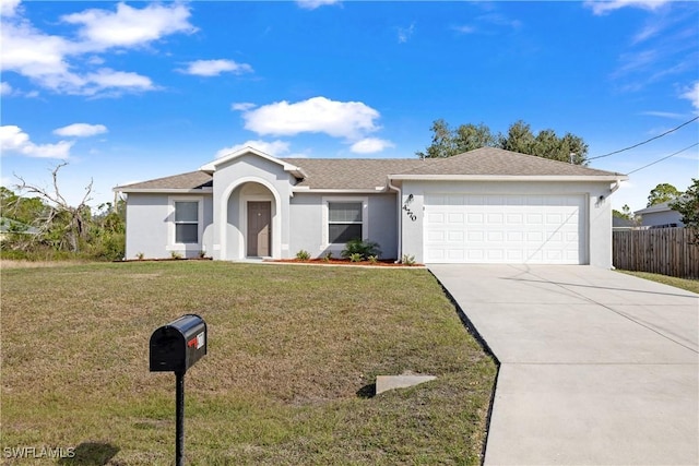 single story home with driveway, an attached garage, fence, a front yard, and stucco siding