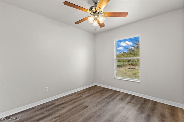 unfurnished room featuring wood finished floors, a ceiling fan, and baseboards