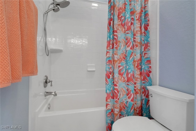 full bathroom featuring toilet and shower / bath combo with shower curtain