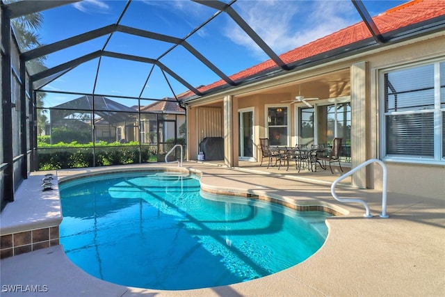 pool featuring ceiling fan, a patio, and a lanai