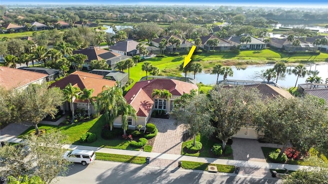 birds eye view of property featuring a residential view and a water view