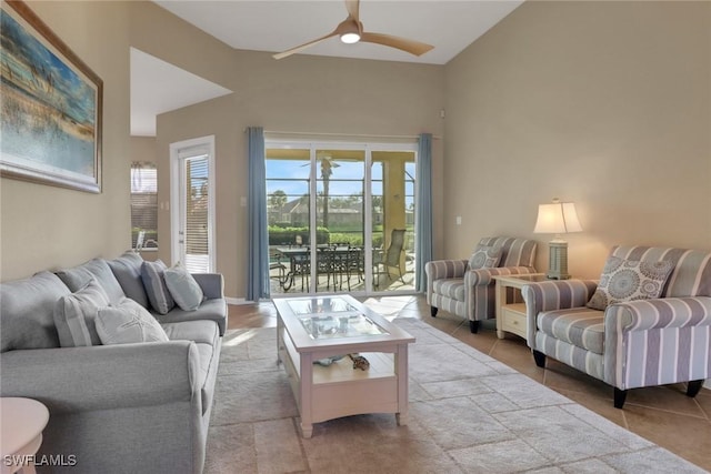 living area featuring light tile patterned floors and ceiling fan