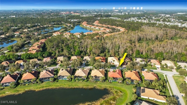 bird's eye view featuring a water view and a residential view