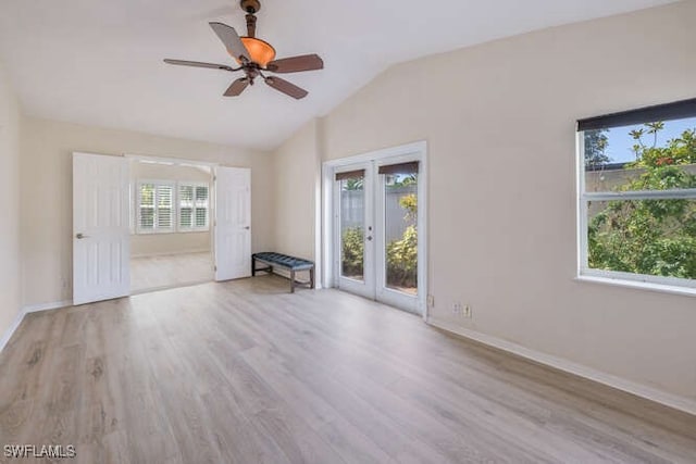 unfurnished room featuring vaulted ceiling, ceiling fan, and light wood-type flooring