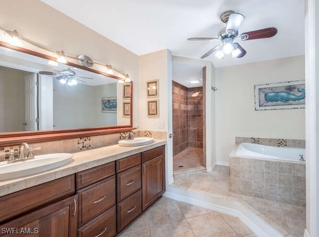 bathroom featuring ceiling fan, vanity, shower with separate bathtub, and tile patterned flooring