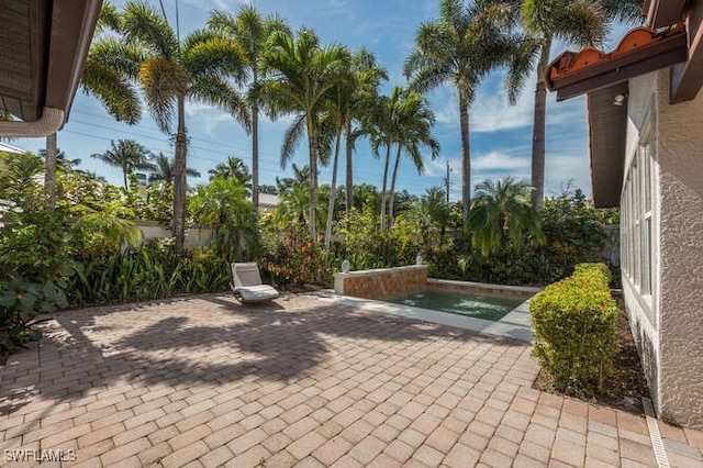 view of patio featuring a swimming pool