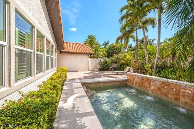 view of pool featuring a patio area