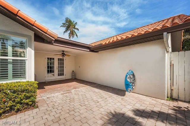 view of patio / terrace featuring french doors and ceiling fan