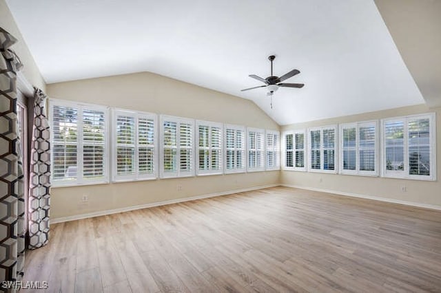 unfurnished sunroom featuring ceiling fan and lofted ceiling