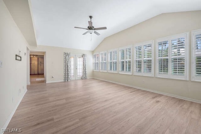 interior space with lofted ceiling, light hardwood / wood-style flooring, french doors, and ceiling fan