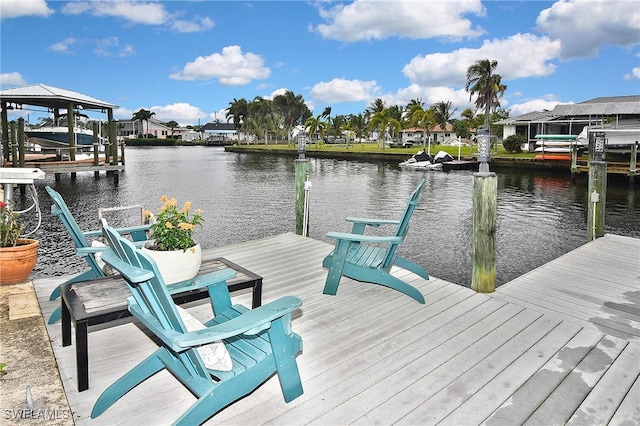 dock area featuring a residential view, a water view, and boat lift