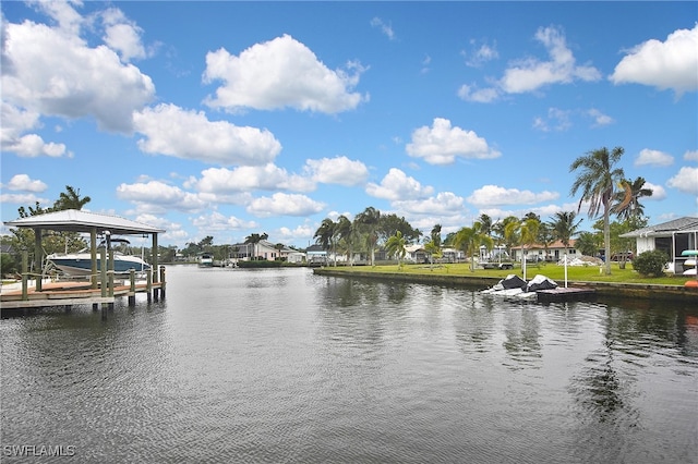 dock area featuring a water view, a residential view, and boat lift