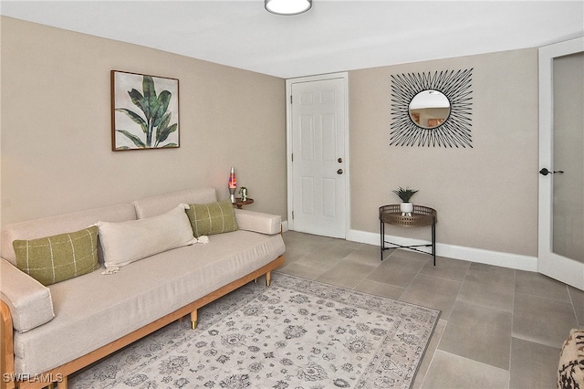 tiled living area with baseboards