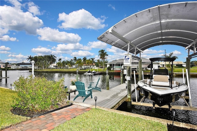 view of dock featuring boat lift and a water view