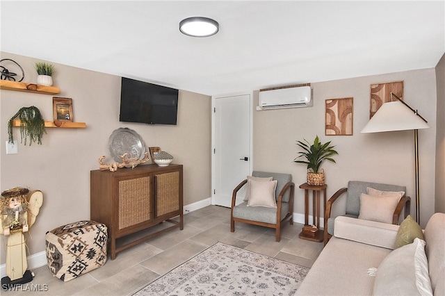 living area with baseboards and a wall mounted AC