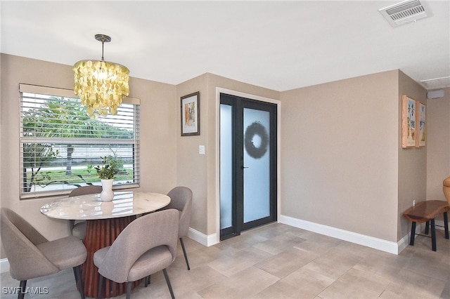 dining room featuring visible vents, baseboards, and an inviting chandelier