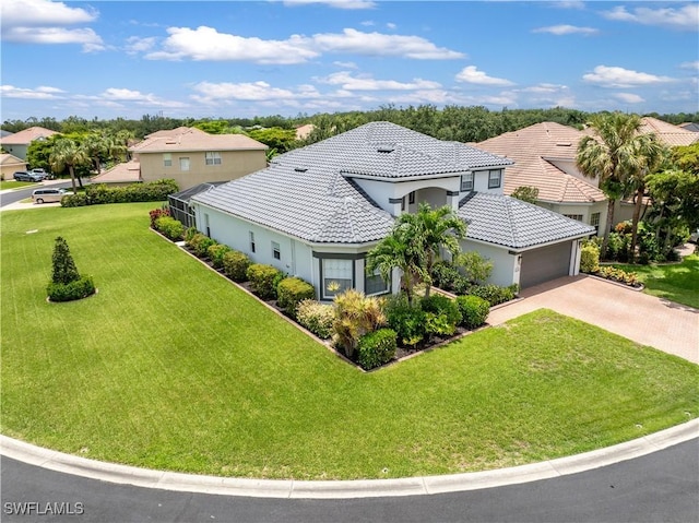 view of front of property with a garage and a front yard