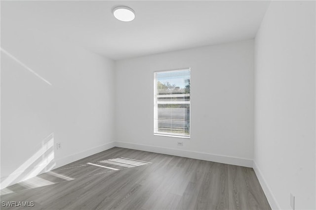 spare room featuring hardwood / wood-style floors