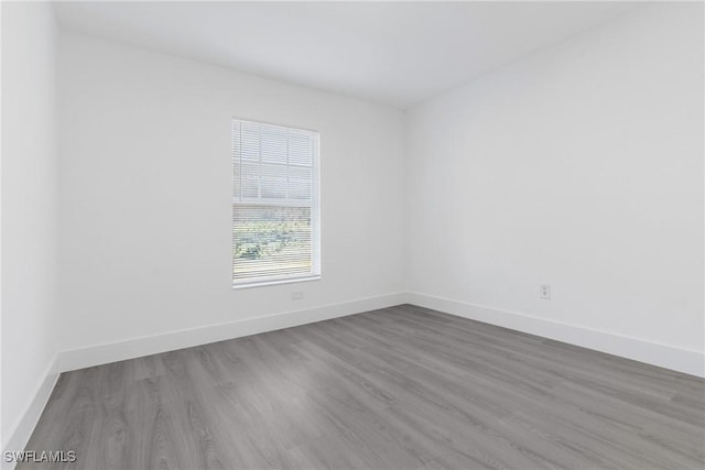 spare room featuring hardwood / wood-style floors